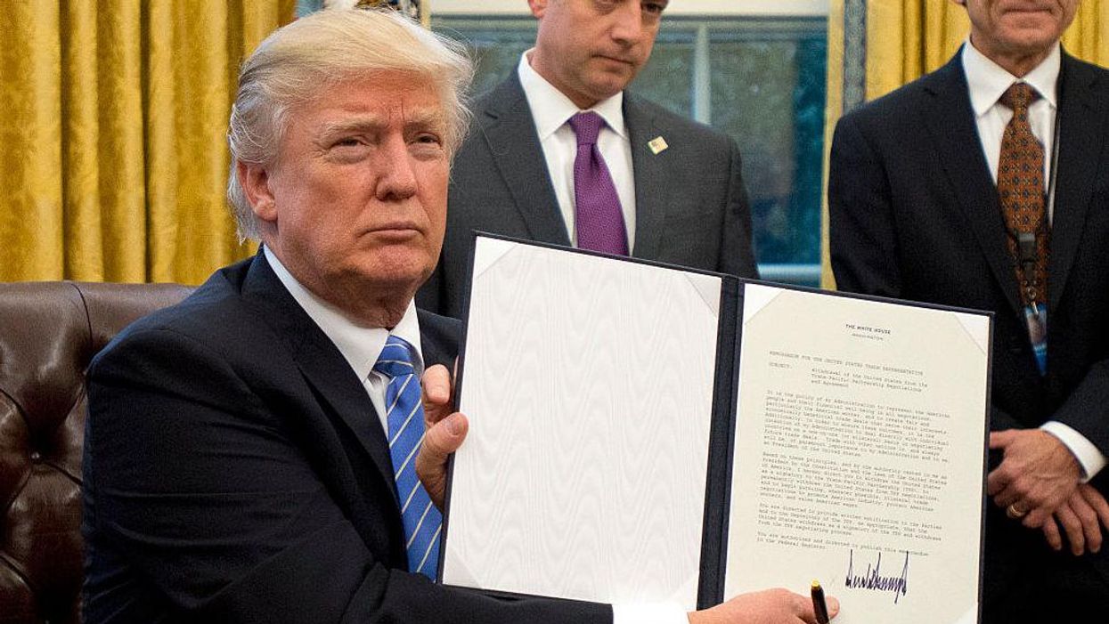 Trump revokes executive order that promised to 'drain the swamp' just hours before leaving office
