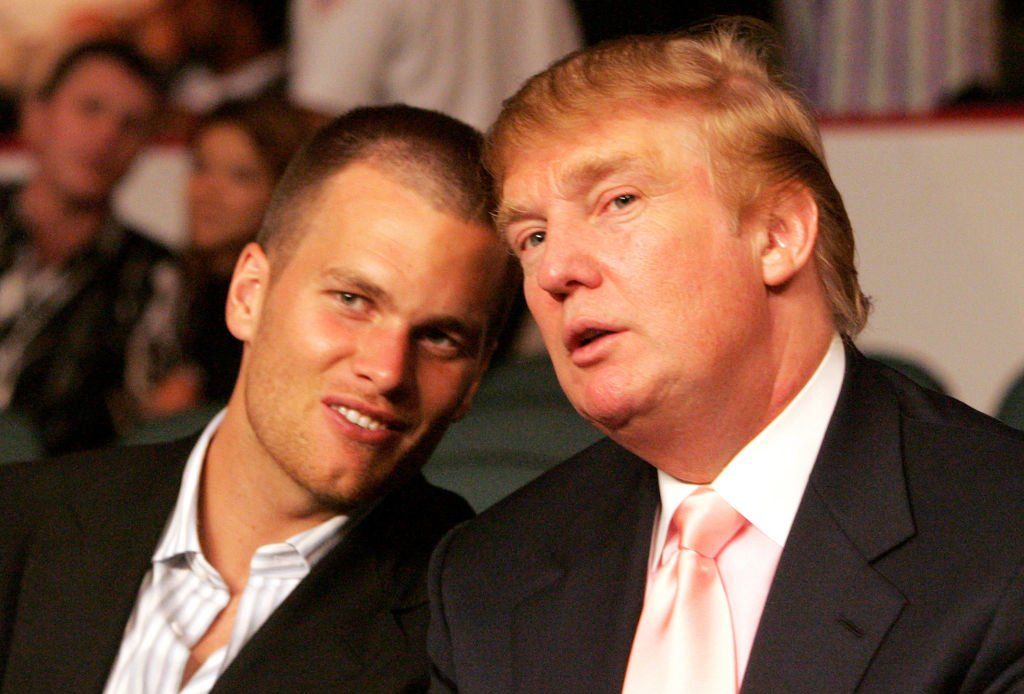 Two GOATs sitting together: Tom Brady and Donald Trump.