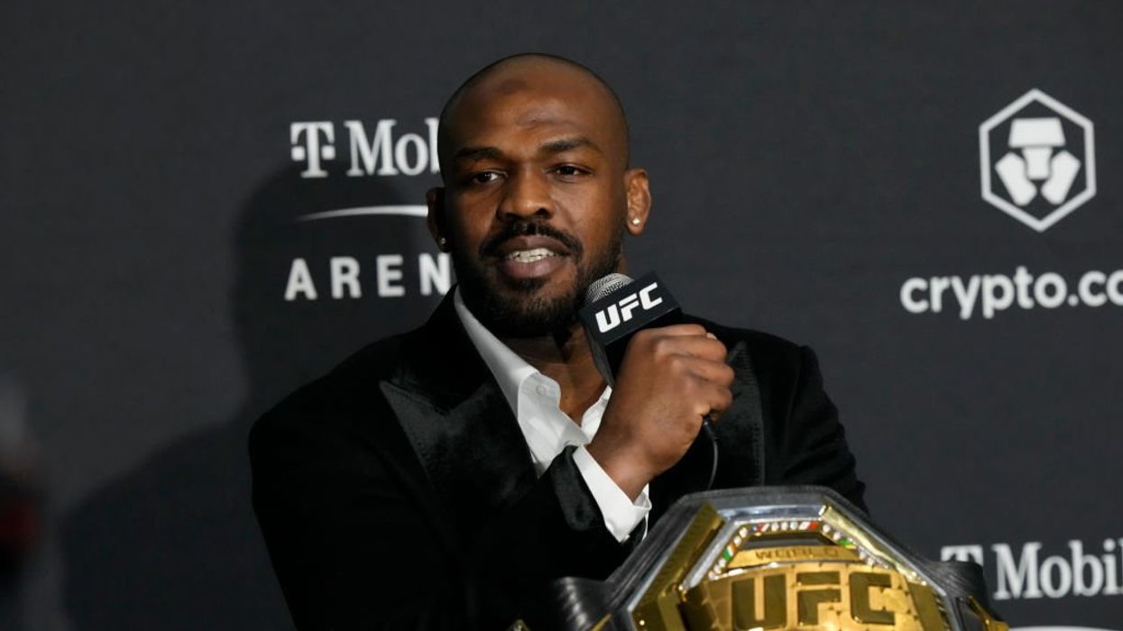 UFC champ Jon Jones accused of death threat by drug tester, who is seen high-fiving him in video after alleged incident