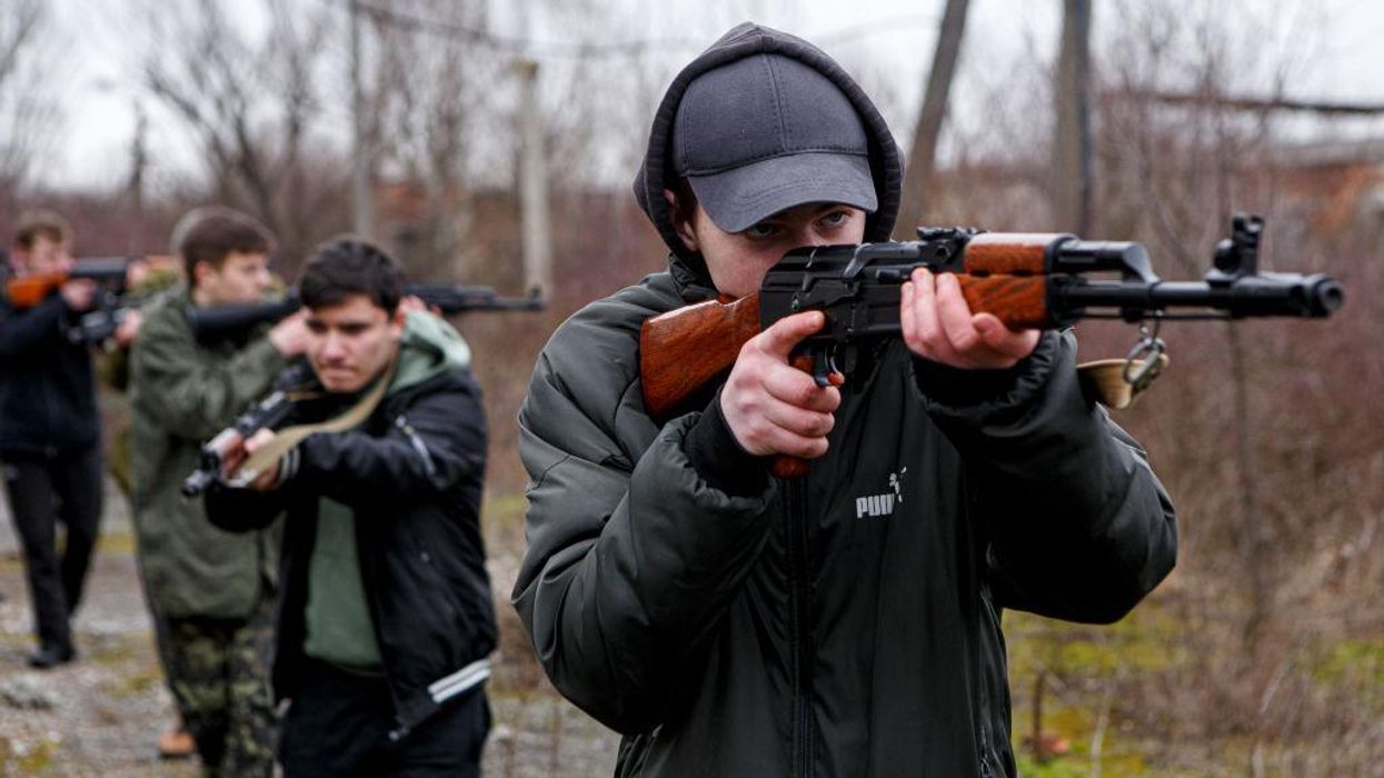 Ukraine's parliament votes to allow citizens to carry guns, act in self-defense amid Russian invasion. Gun stores are already bustling.