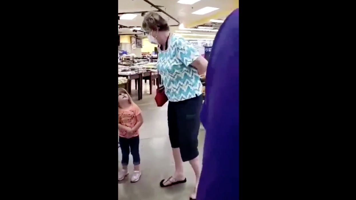 Unhinged, mask-wearing woman screams in small children's faces: 'I hope you all die!'