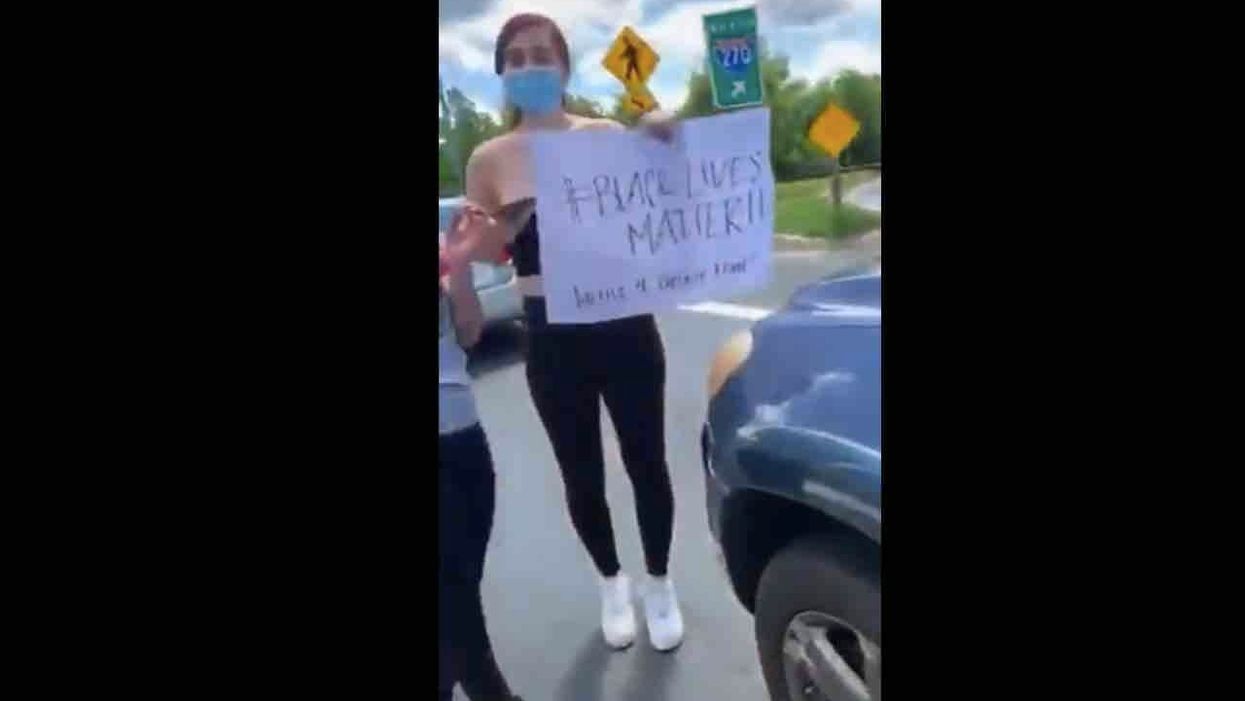 Unhinged protester screams at drivers, 'Do black lives matter to you?!' Things get scary for one woman.