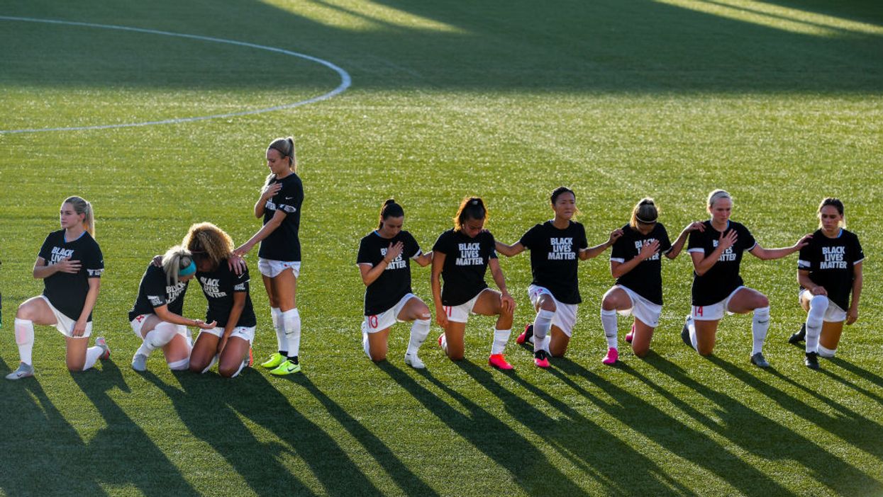 US soccer player Rachel Hill stood for the anthem when everyone else kneeled. She explains why.