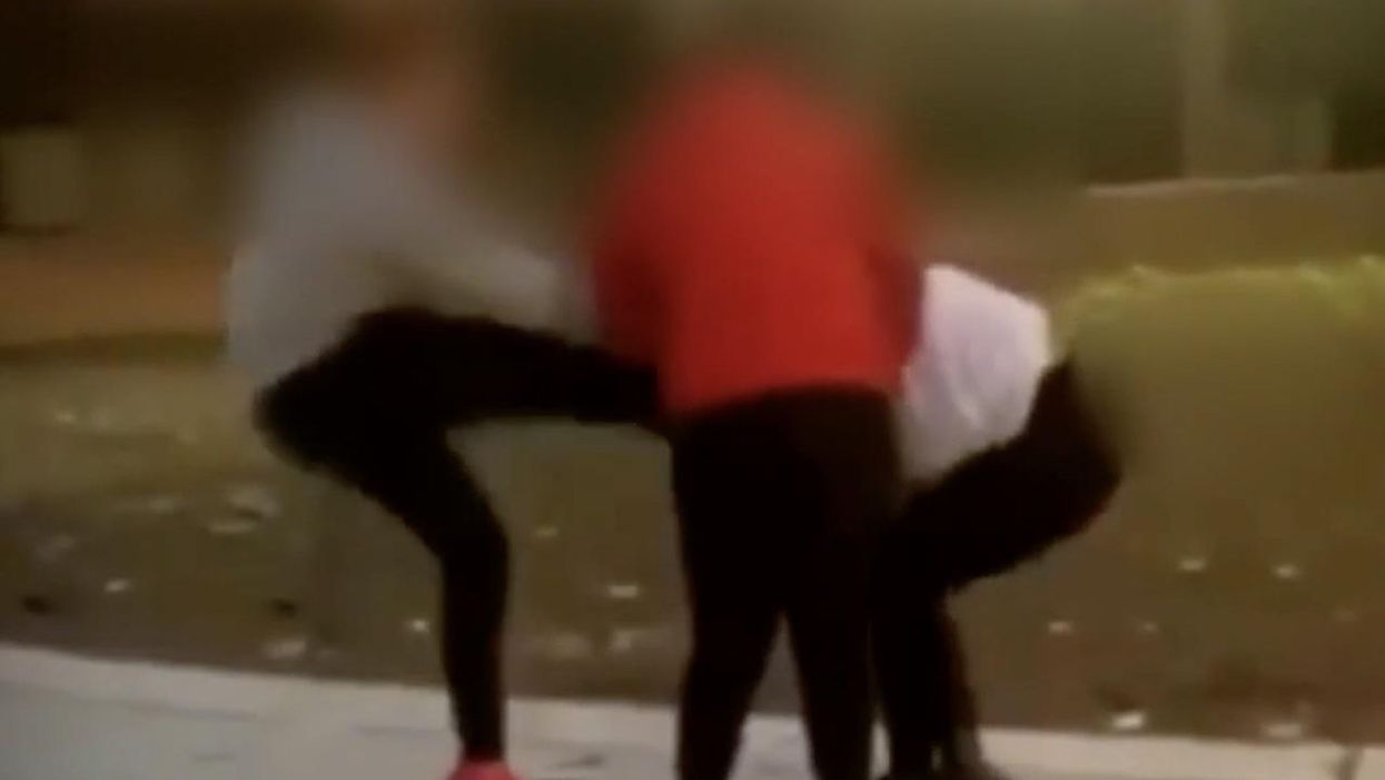'Very brutal': Woman in her mid-20s caught on video joining fight between two middle school girls, police say — and punching, kicking one girl in her head, face