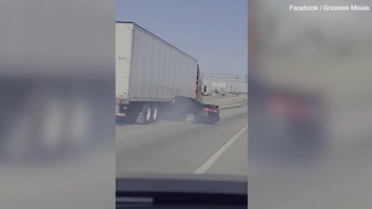 Video: 18-wheeler drags a pinned sedan sideways down a Chicago highway as the driver desperately tries to flag down help