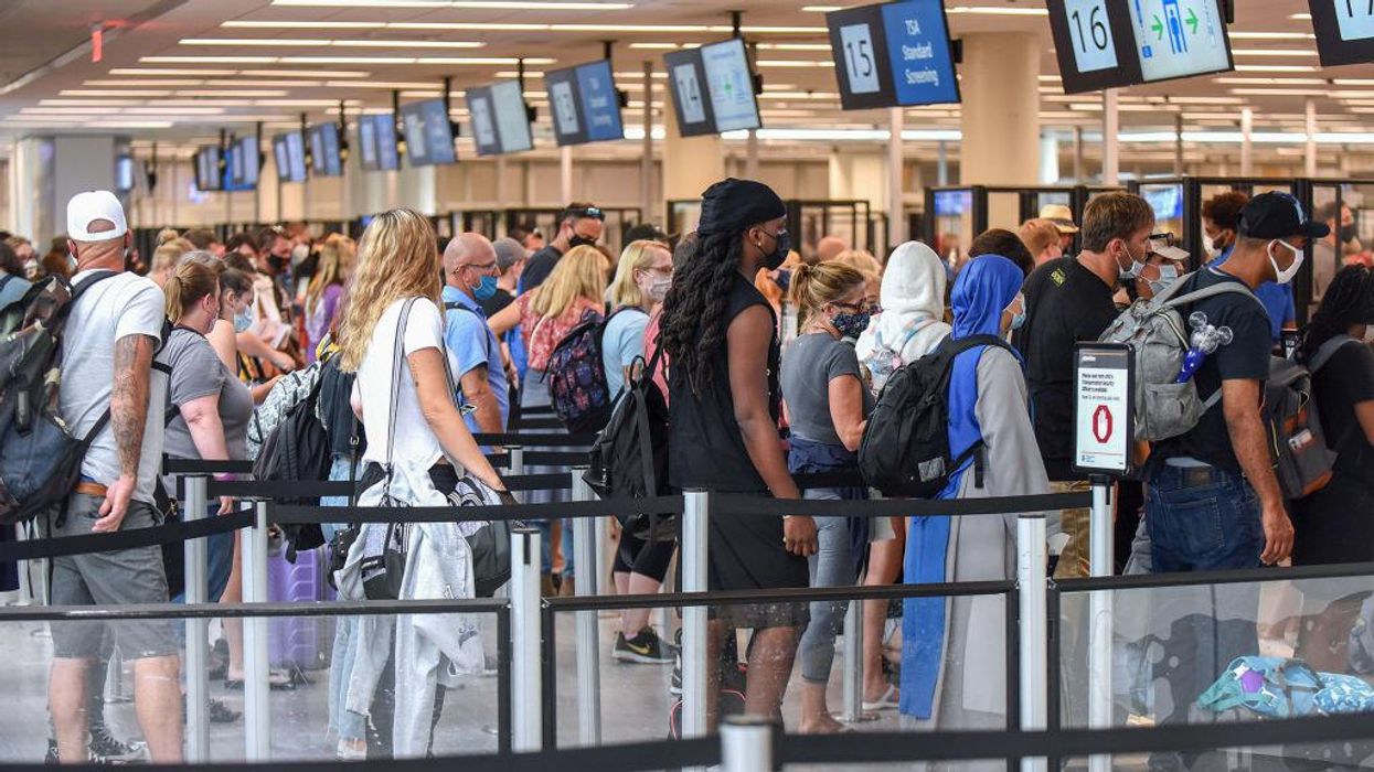 VIDEO: After missing flight, mother attacks airport staff as daughter begs her to stop: 'Mommy! I don't want you to go to jail!'