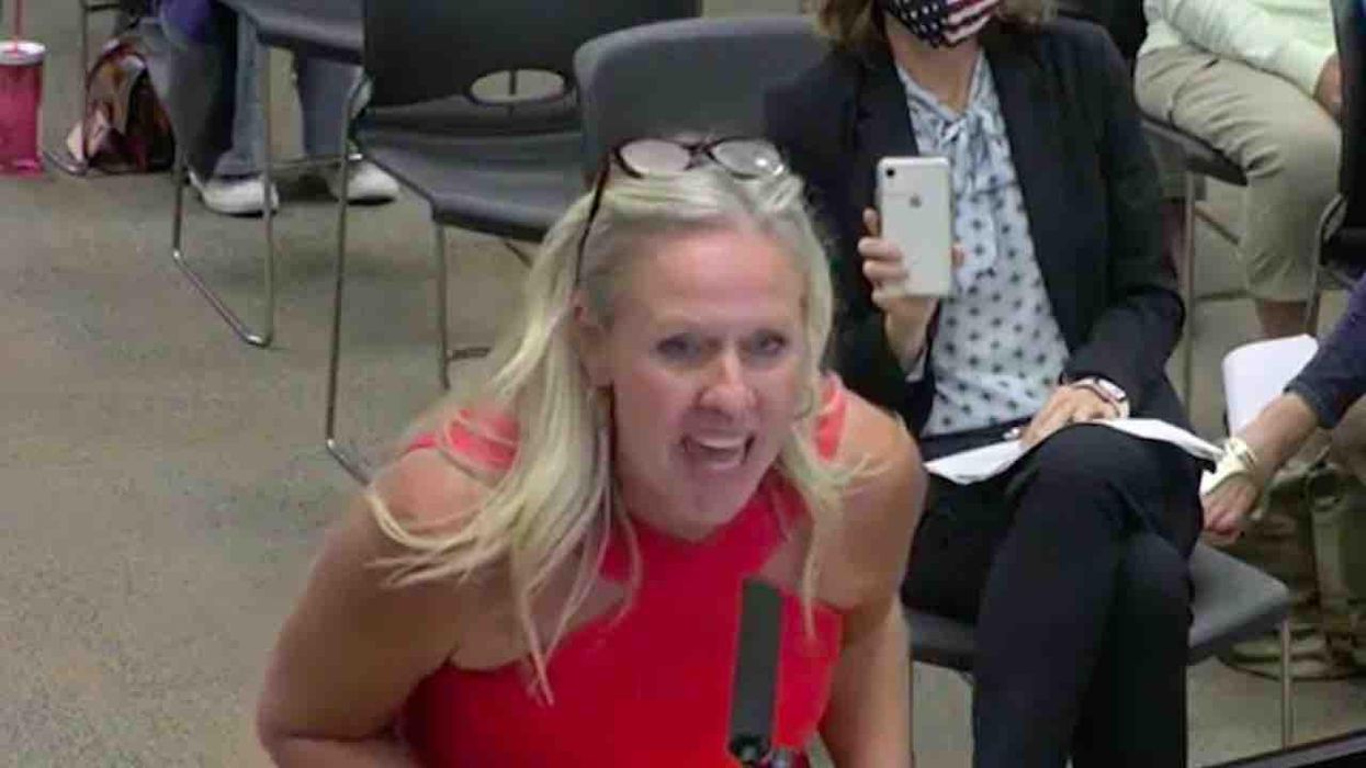 VIDEO: Angry mom reads anal sex passage from junior high library book to school board. Mom's mic is cut off, but district pulls book for review.
