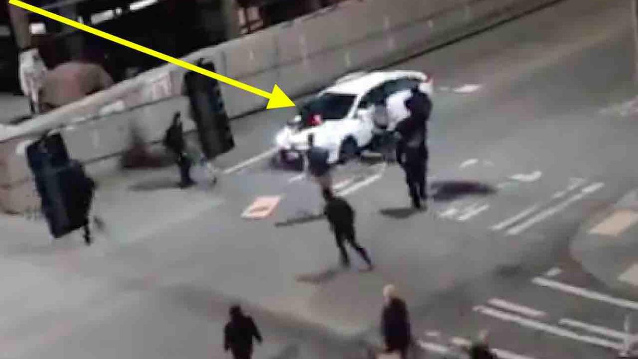 VIDEO: Antifa militant jumps on car's hood as fellow comrades close in. So the driver — reportedly an elderly man — hits the gas.