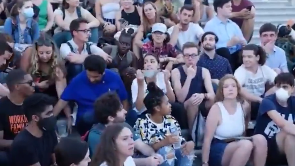 VIDEO: AOC caught putting on mask for photo op, goes without it before and after