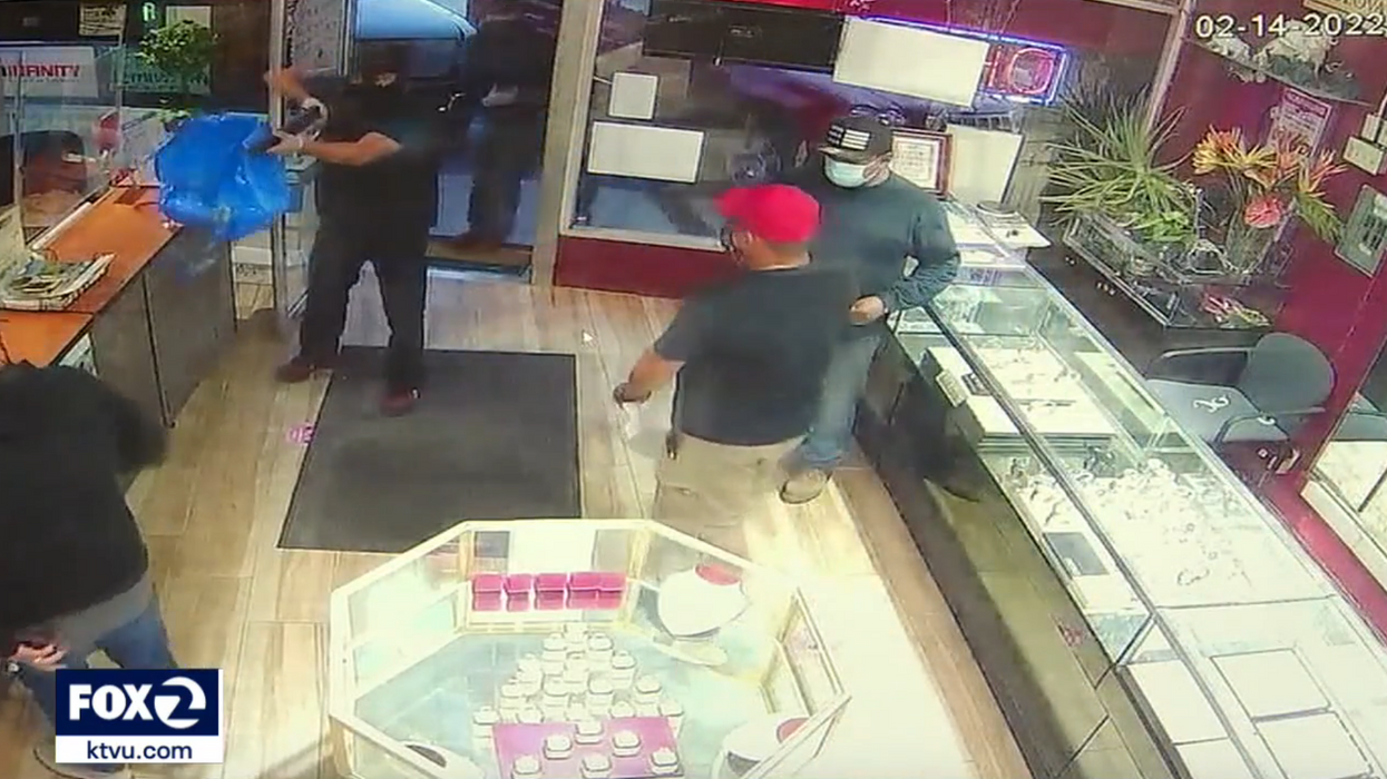 VIDEO: Armed robbers sent running for their lives when store owner shows he has a gun, too — and he's not afraid to use it