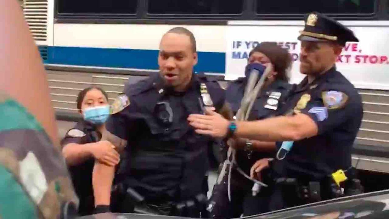 VIDEO: Black Lives Matter protesters call NYPD cop the N-word — and the officer has to be restrained by his colleagues
