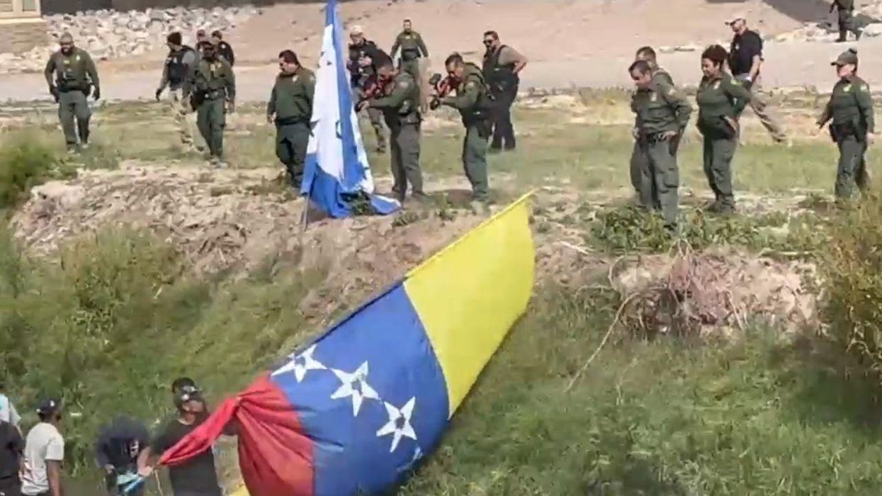 Video: Border Patrol fires crowd-control projectiles during tense clash with large group of migrants who attempted to rush across southern border