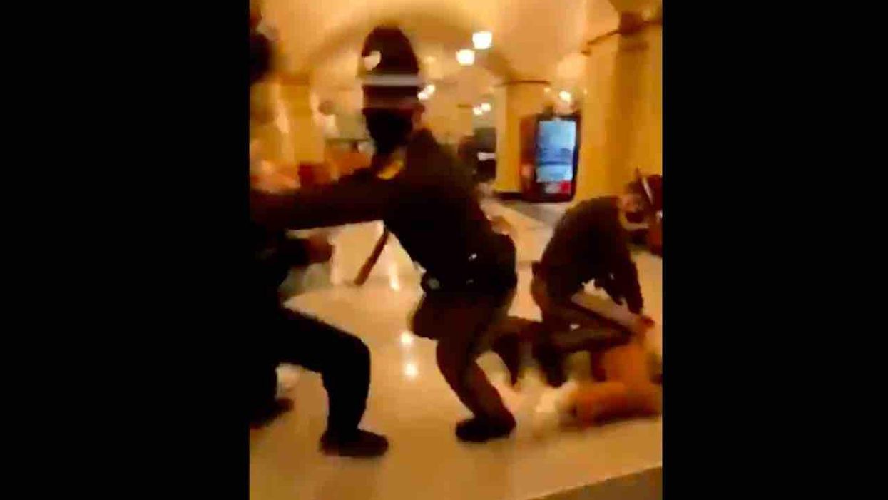 VIDEO: Chaos erupts inside Iowa Capitol building when female protester, 18, is arrested: 'She's a f***in' kid, bro!'