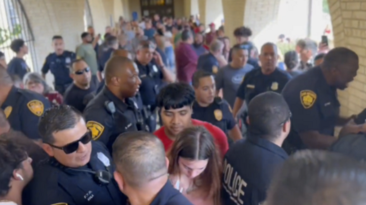Video: Chaos erupts when Texas parents clash with police after false school shooting alert, officer slams wounded man to the ground