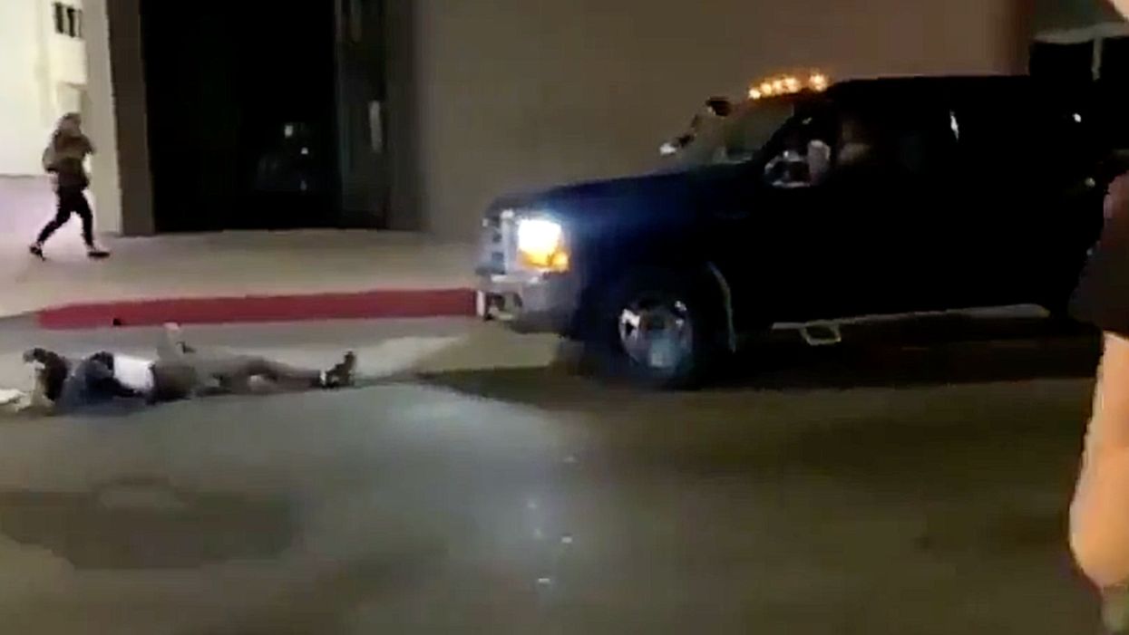 VIDEO: Crowd swarms pick-up during Hollywood protest after driver strikes protester. As things get crazy, pick-up speeds off.