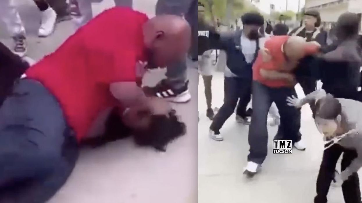 Video: Dad gets in massive brawl with students on high school campus. Conflicts between students and his sons apparently sparked it.