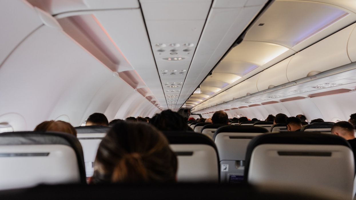 Video: Flight attendant repeatedly pounds fist on male passenger who allegedly was attacking female sitting in front of him