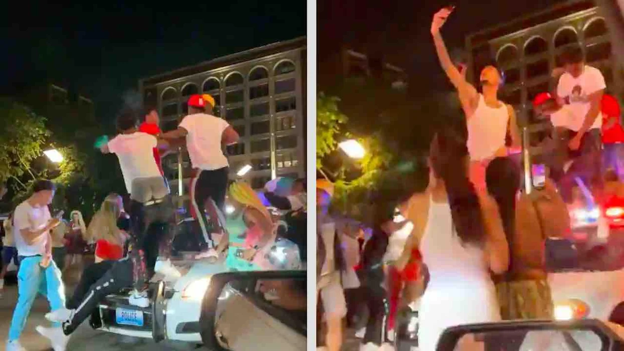 VIDEO: Late-night revelers jump on top of police car — with officer inside. Officials, residents are disgusted.