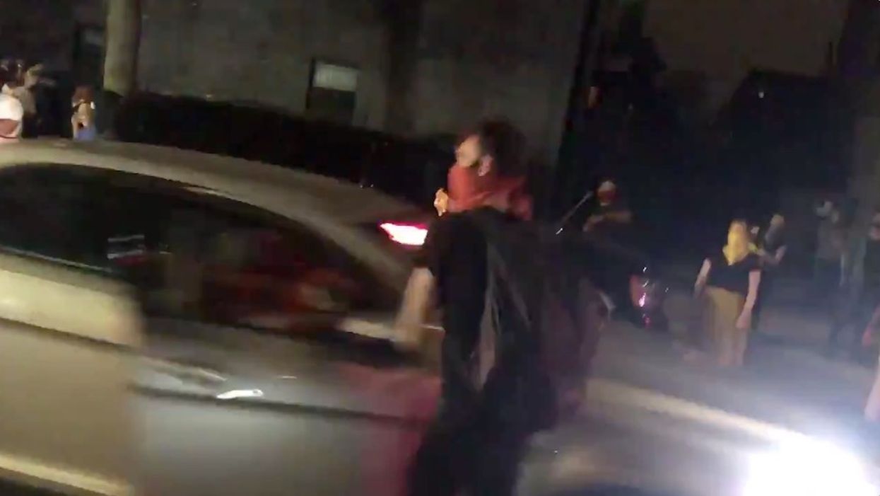 VIDEO: NYPD cop loses gun and badge after smacking protester with car door