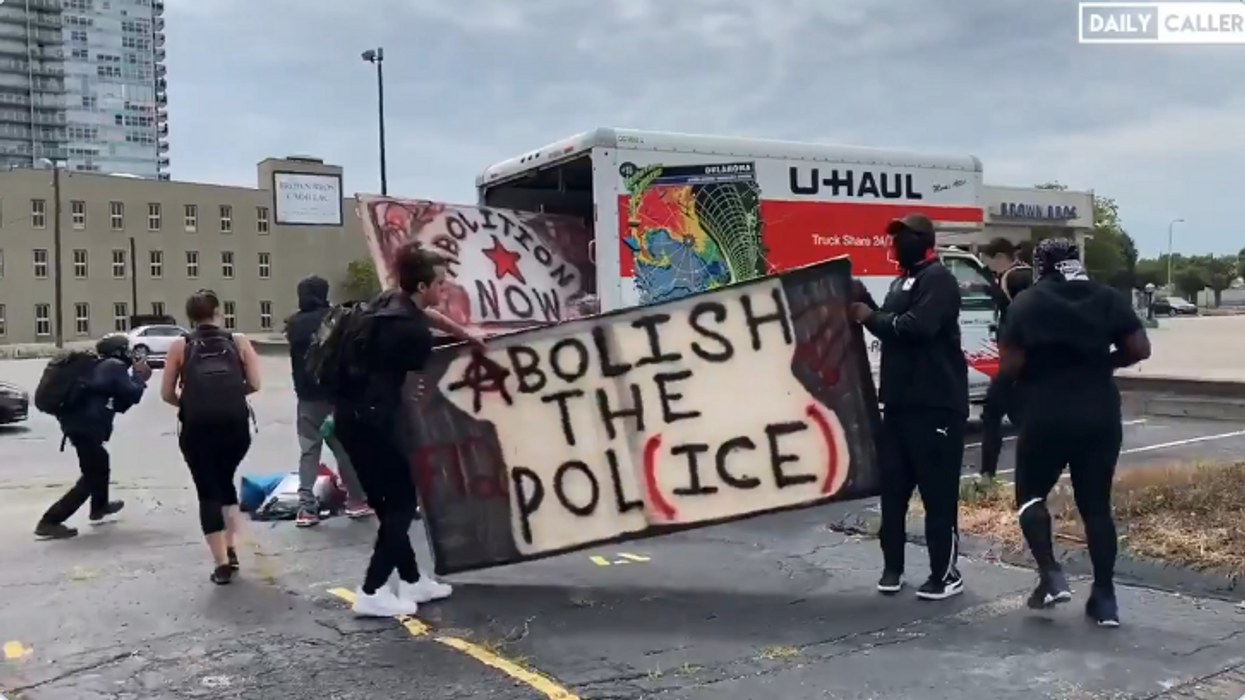 VIDEO: Parked U-Haul truck distributes riot shields, signs, other supplies to BLM protesters in Louisville