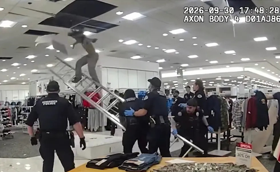 Video: Punk pays the price after cops catch him crawling above department store ceiling