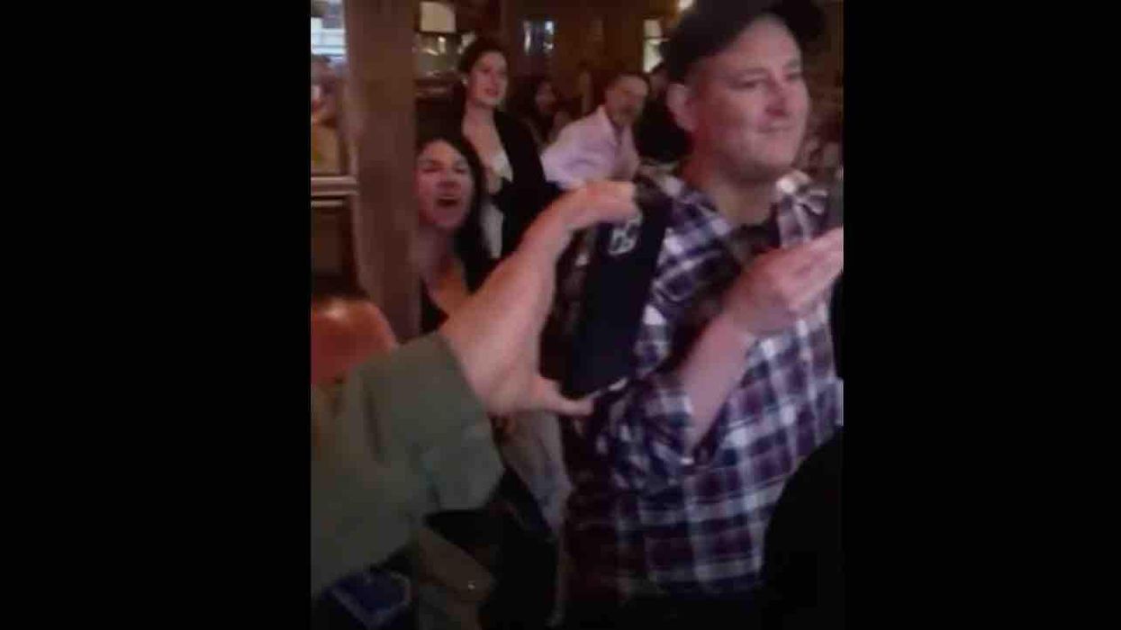 VIDEO: Restaurant patrons chant 'get out!' at officials issuing COVID-19 closure order. Cheers erupt when they turn tail and leave Canadian eatery.