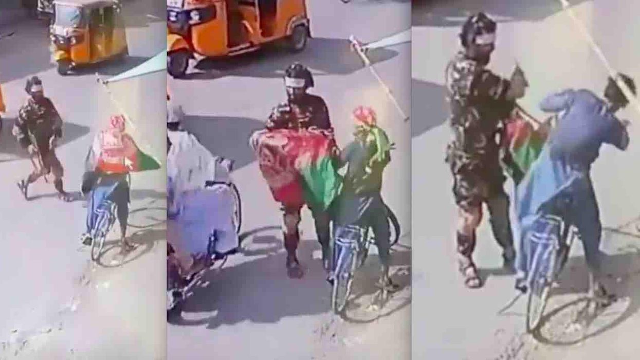 VIDEO: Rifle-wielding Taliban militant rips Afghan flags from bicyclist, slaps him, and takes flags away. It reminds many of Antifa violence in US.