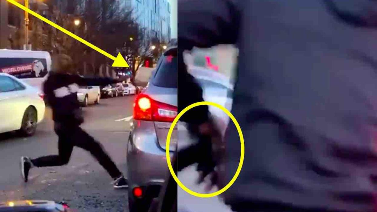 VIDEO: Road rage perp physically attacks motorist on Philly street, chucks heavy debris at vehicle — and appears to grab a gun