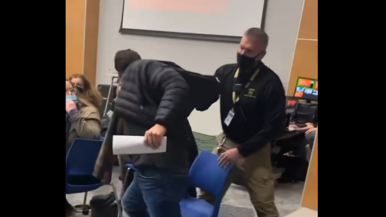 Video: Security guards forcibly remove maskless man from school board meeting