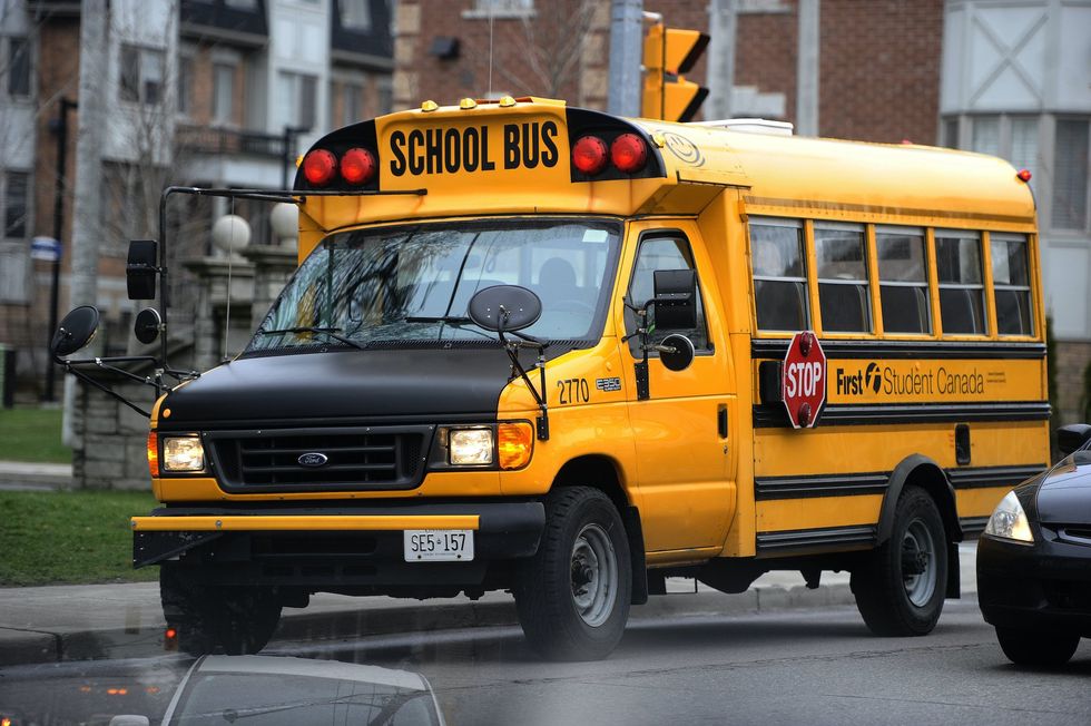 Video shows angry parents confronting male school bus driver in 'school girl' dress who allegedly gave route 'disturbing' name