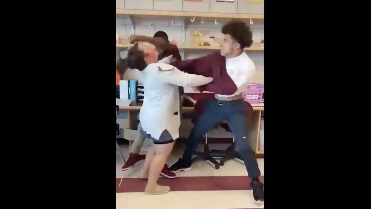 Video: Teacher punched in face, knocked to floor as she tries to break up vicious fight between two 15-year-old males in HS classroom