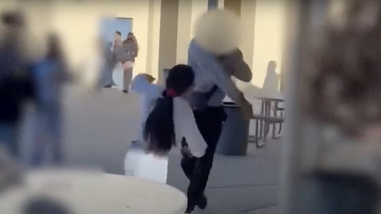 Video: Trans student 'born male' who allegedly showed 'his genitals' in HS girls' locker room absolutely towers over girl in lunchtime fight