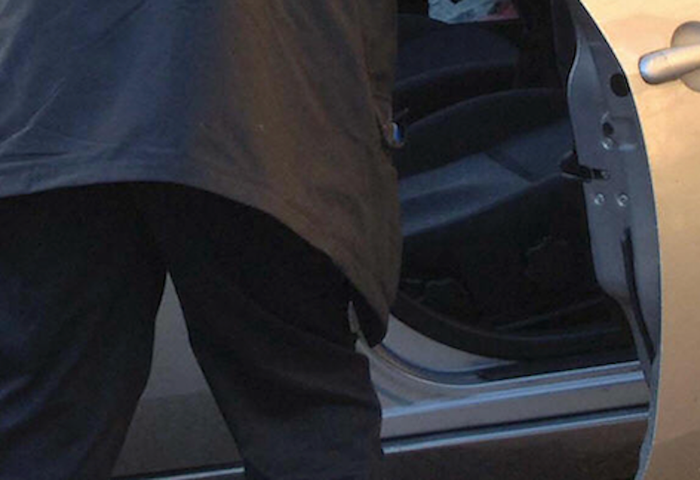 Video: Woman pulls male intruder out of her car, throws him to the ground with ease — while her amazed husband watches