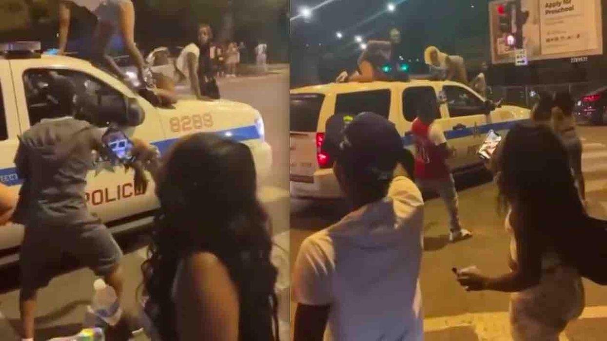 VIDEO: Women twerk atop Chicago police SUV while it's moving. Cops say they're investigating; observers say it's disgusting.