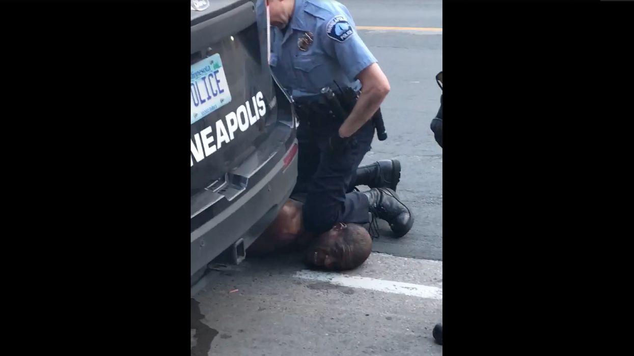 Viral video shows police officer kneeling on groaning, motionless man's neck. The man later dies.