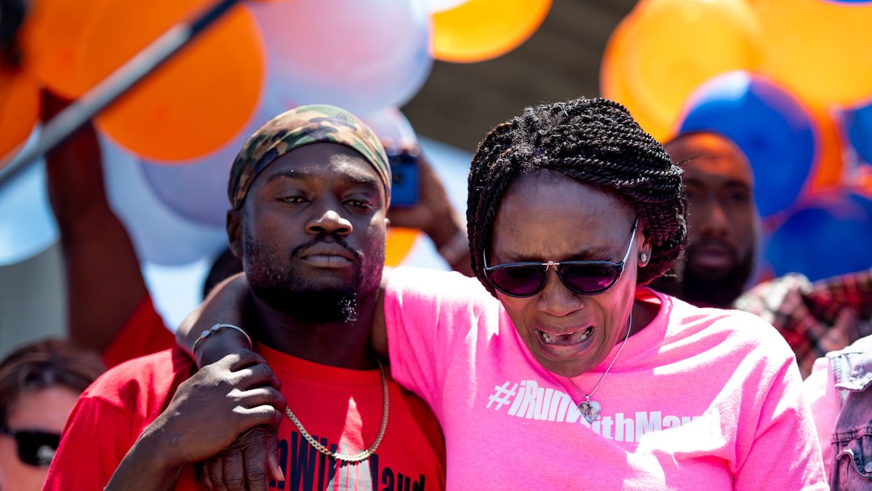 Wanda Cooper-Jones (R), mother of Ahmaud Arbery, weeps while people gather to honor her son at Sidney Lanier Park on Saturday in Brunswick, Georgia.