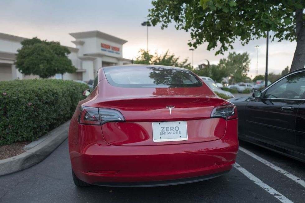 Watch: Suspect accused of scrawling swastika into Tesla sings a different tune when confronted by EV owner