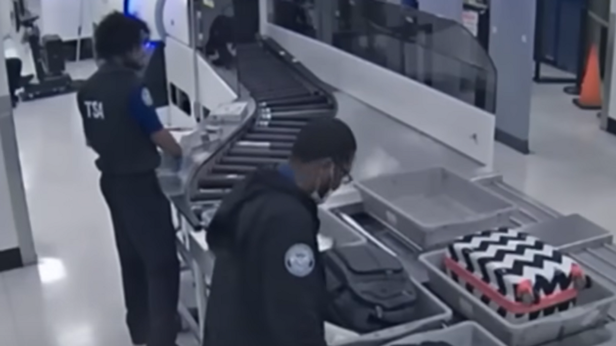 Watch the moment TSA agents are allegedly caught on video stealing passengers' valuables