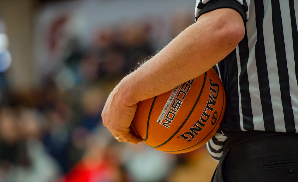 White-haired HS basketball referee knocked down by thrown objects after game; coach allegedly 'involved' in incident is fired