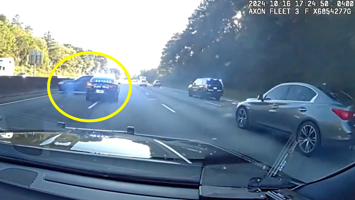 Wild police video: Cops ram car driven by female armed robbery suspect — who actually tries to run away after freeway crash