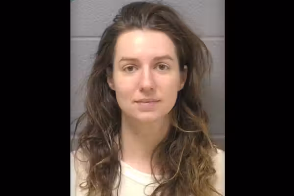 Woman accused of fatally shooting father of her 2 children amid surprise massage — and then turning gun on his parents