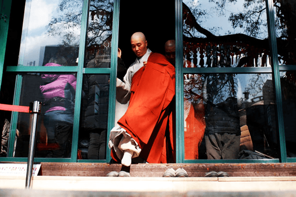 'Yes, I will devote myself': Korean monks initiate Chinese robot that could actually spy on them