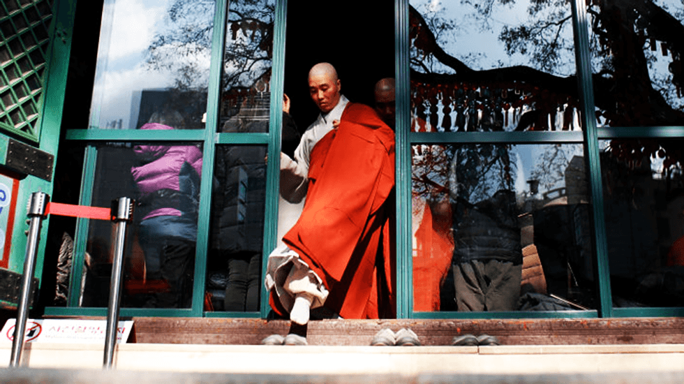 'Yes, I will devote myself': Korean monks initiate Chinese robot that could actually spy on them