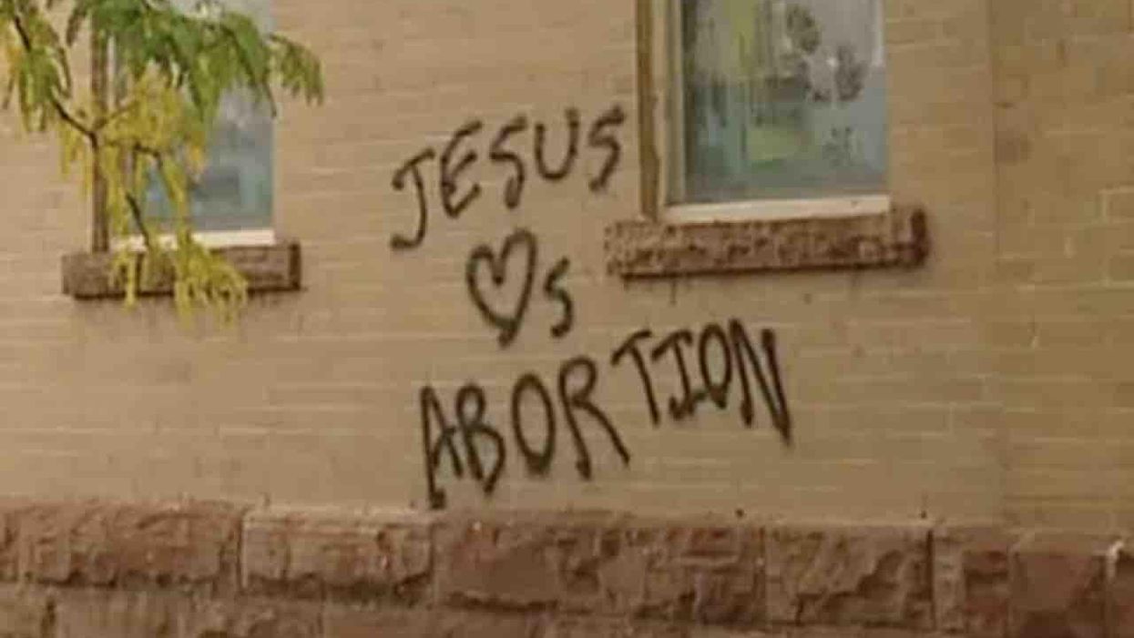 'You've got to be really hurting to do this kind of destruction': Pro-abortion vandals spray-paint church, topple and trample crosses